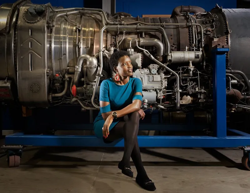 Gladys Ngetich in front of a jet engine