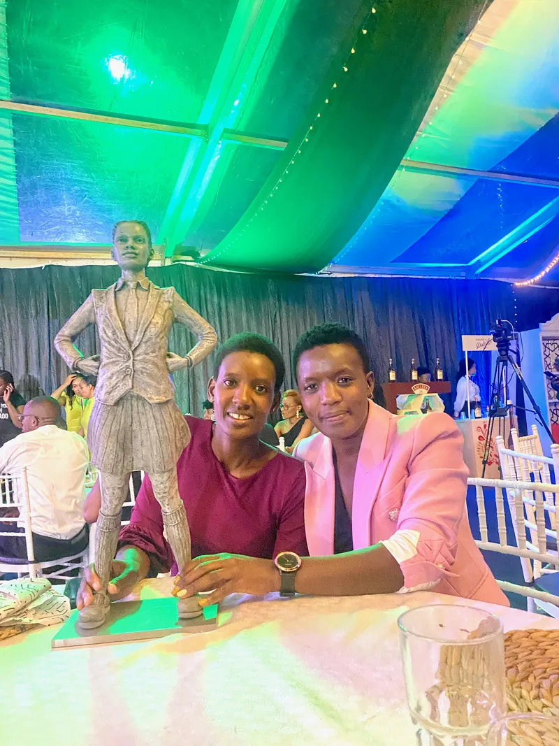 Gladys Ngetich at the Africa Gender Mainstreaming Awards with RMB's Fearless Thinker sculpture
